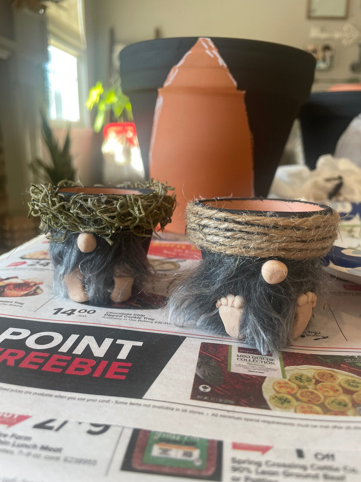 Three handmade mini gnome planters with succulents, fuzzy beards and twine, moss and red hats